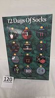 Front of sealed 12 Days of Socks box showing holiday design and numbered windows