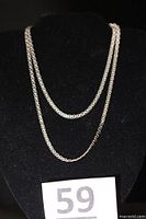 Full view of the necklace draped to show length and style