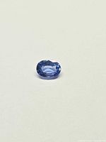 Front view of oval faceted cornflower blue sapphire