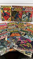 Group shot of all comics spread out showing covers and top three key Jungle Action issues upright