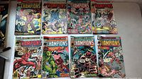 All eight Champions comic books laid out, showing full covers and condition