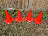 All four cones side by side on grass