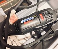 Close-up of Dremel MultiPro Model 395 tool body showing speed control and label