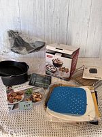 Full set: baking pan, silicone liners, paper liners, rack, recipe book, chart and packaging