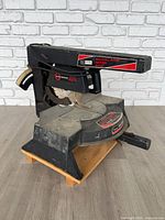 Full view of Craftsman radial arm miter saw on wood base