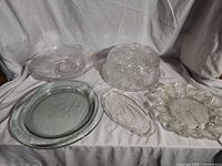 Group shot of five clear glass serving pieces