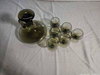 Decanter with stopper and six glasses top view
