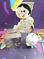 front view of all three coin banks