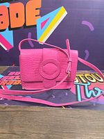 Angled front view of entire bag with strap visible