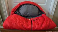 Red Woods Adventurer sleeping bag opened showing grey lining