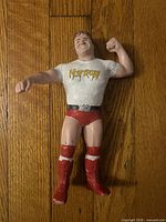 Front view of Rowdy Roddy Piper figure showing logo, attire, and overall condition