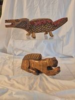 Both figurines side by side showing size relation