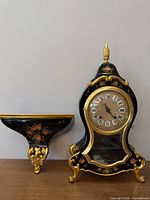 Clock and wall bracket shelf front view