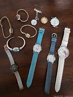 All ten watches laid out on table
