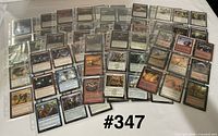 Front view of assorted Magic cards in binder sleeves