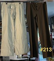 Both pairs of pants hanging: brown Talbots, light khaki Gap