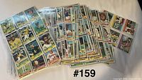 Fronts of assorted 1976 Topps cards, stack and sleeves visible