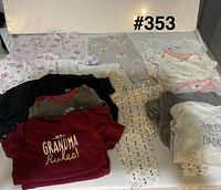 All garments laid out showing quantity and general condition