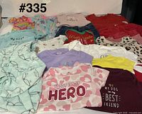 Group shot of all clothing to show variety and condition