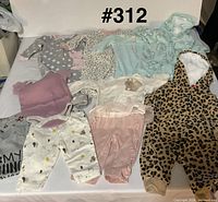 All ten garments laid out together showing styles and colours