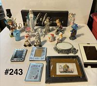 Group shot showing all items including sign, figurines, frames, plaque and dish