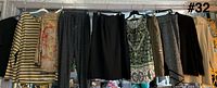 Nine garments hanging, full lot overview