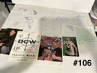 All autographed sheets, flyers, and photos spread out