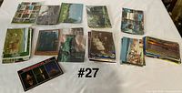 Stacks of postcards arranged in groups on table