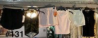 All six clothing items hanging on rack