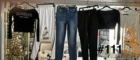 All six clothing items hanging on rack
