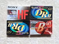 Front view of four sealed cassette tapes: Sony HF60, two Fuji DRII 60, TDK B60