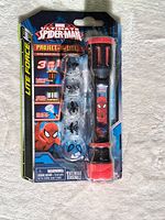 Front view of sealed Spider-Man Project-A-Lite flashlight package showing flashlight and four discs