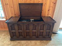 Full view of closed cabinet with lid open showing interior components