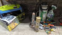Overall lot showing mower, sprayer, bird feeders, tools