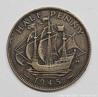 Reverse of 1945 British half penny showing sailing ship and date