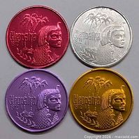 Group shot of four colored Cleopatra 1972 doubloons