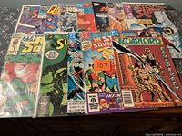 All 12 bagged comic books laid out