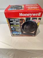 Front of boxed Honeywell HT-809 fan