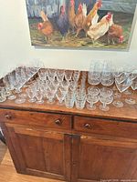 Full lot overview on buffet showing variety of stemware types