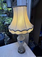 Lamp illuminated with shade attached
