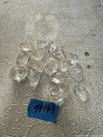 Group of clear quartz polished stones on patterned surface