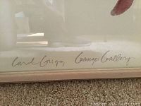 Close-up of artist's signature and gallery name on print corner