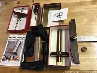 Overview of all six boxed tools laid out on workbench