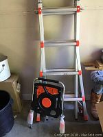 Side view of folded stool against wall