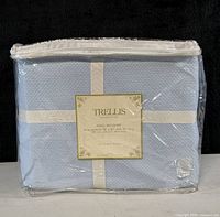 Front view of packaged Trellis king bedskirt