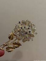 Front view showing crystal flower and gold-tone leaves