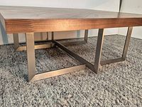 Full view showing walnut chevron top and metal base