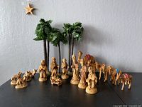 Full nativity arrangement with figures, animals, camels, palm trees