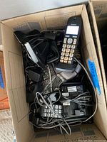 Box containing multiple cordless handsets, bases, cords