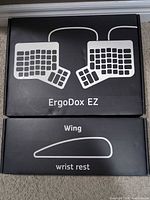 Retail boxes showing ErgoDox EZ keyboard and Wing wrist rest labels